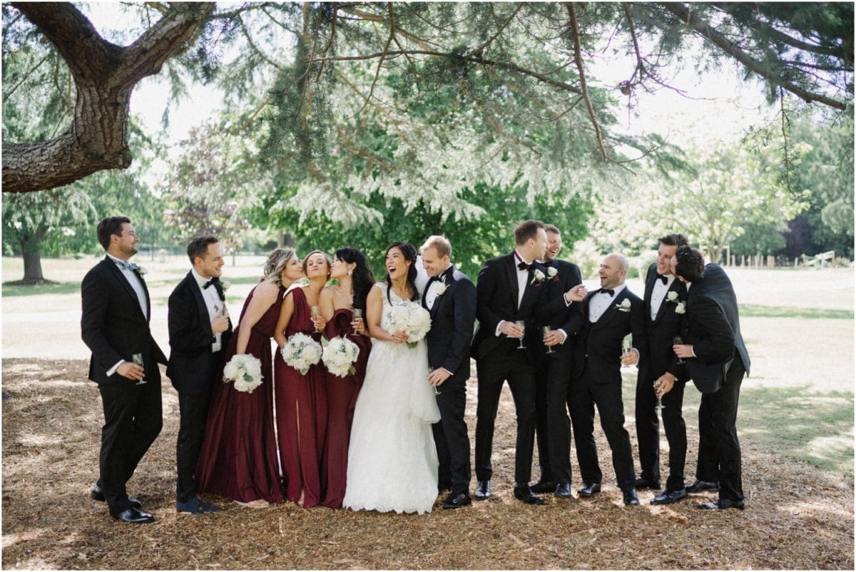 A bridal party laugh at a Deve Beaumont Estate wedding