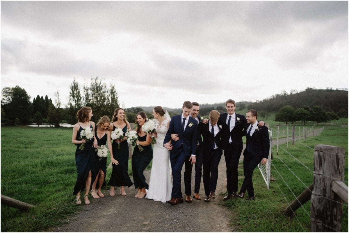 A bridal party laughs at a Stables Bendooley Estate wedding