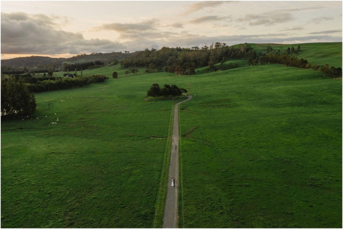 A drone shot of a newly married couple after their Stables Bendooley Estate wedding